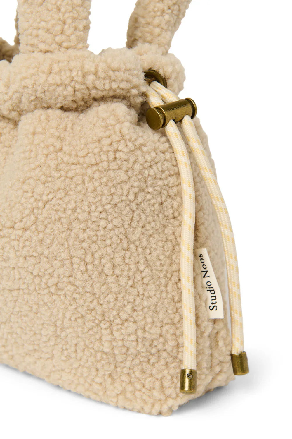Ecrukleurige teddy mini-tas met trekkoordsluiting
